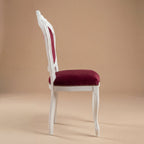 Side profile showing elegant cabriole legs and white satin finish of the Louis Philippe style chair.
