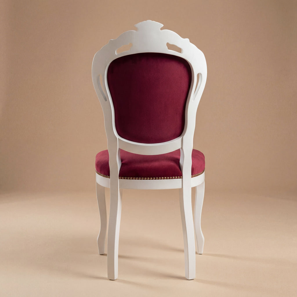 Solid wood backrest of white Louis Philippe dining chair showing sturdy construction and finish.
